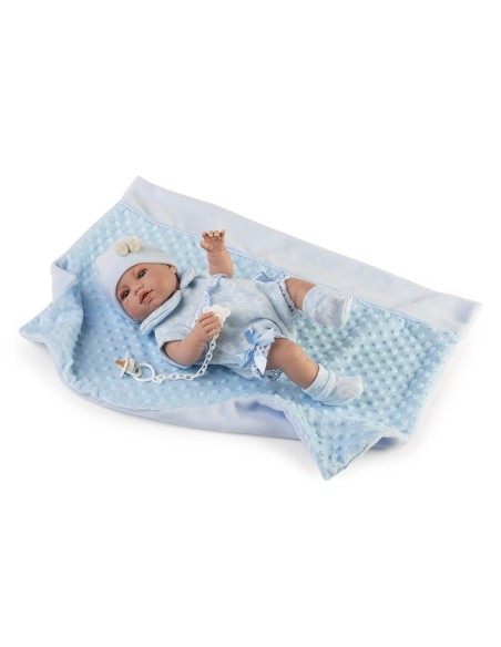Newborn with blue romper and boxed blanket