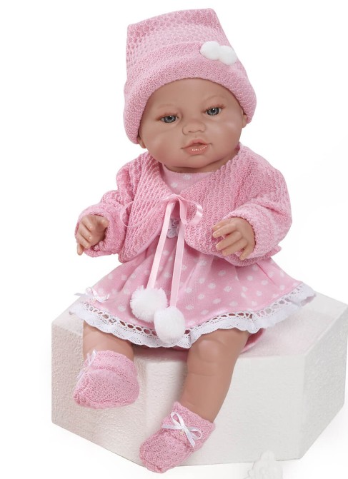Cardigan nouveau-né avec tricot rose et bonnet à pompon dans un sac