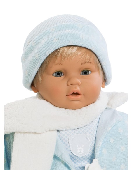Baby dulzon crying with the blue suit and scarf in the bag